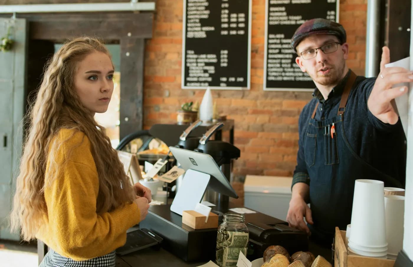 Photo of woman ordering at cafe counter